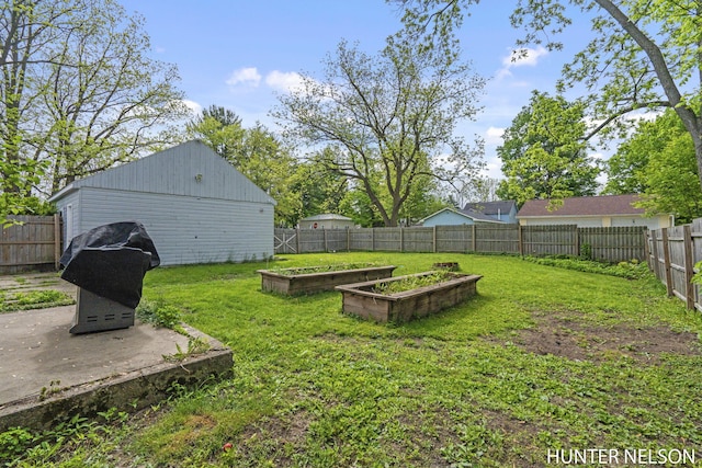 138 E Lake St, Sand Lake, MI 49343 - view of yard with a vegetable garden and a patio