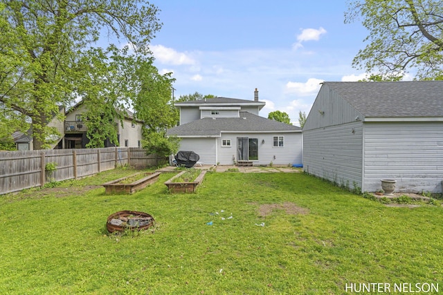 138 E Lake St, Sand Lake, MI 49343 - back of house with a garden and a shingled roof