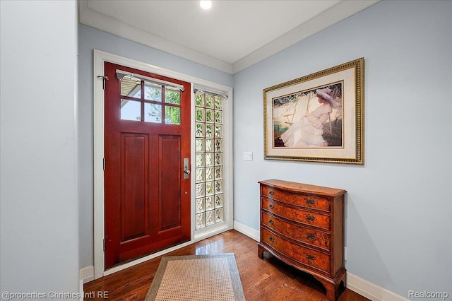 6727 Lahser Rd, Bloomfield Hills, MI 48301 - entrance foyer featuring dark wood-style floors, baseboards, and ornamental molding