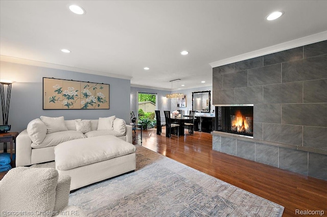 6727 Lahser Rd, Bloomfield Hills, MI 48301 - living area featuring recessed lighting, wood finished floors, ornamental molding, and a tile fireplace
