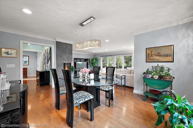 6727 Lahser Rd, Bloomfield Hills, MI 48301 - dining space with ornamental molding, wood finished floors, recessed lighting, and baseboards