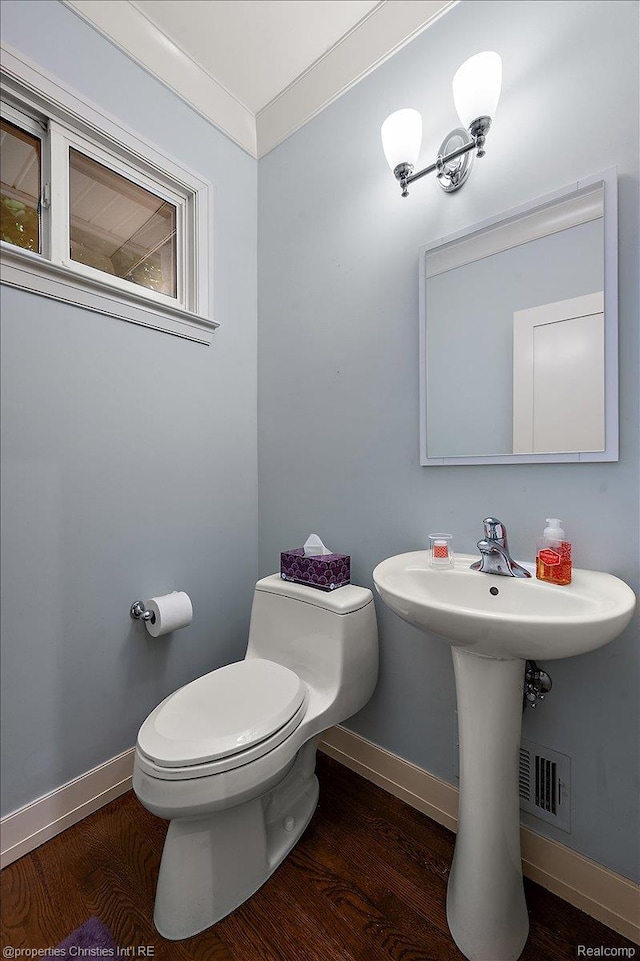6727 Lahser Rd, Bloomfield Hills, MI 48301 - bathroom with toilet, wood finished floors, baseboards, and crown molding