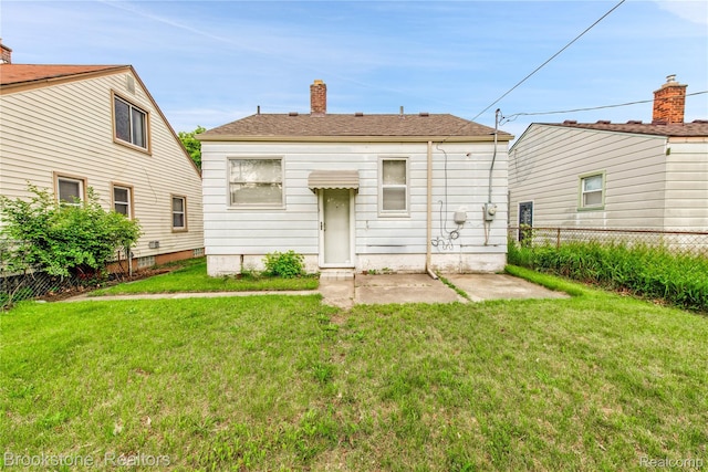 18410 Fenelon St, Detroit, MI 48234 - rear view of property with a chimney