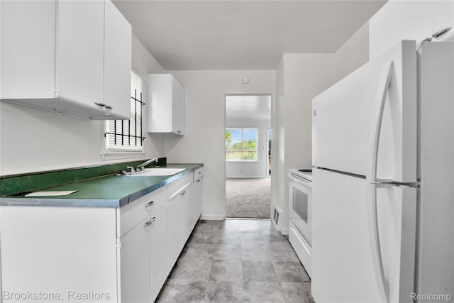 18410 Fenelon St, Detroit, MI 48234 - kitchen with white appliances, a sink, white cabinetry, and baseboards