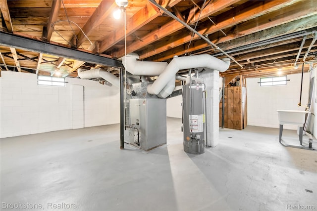 18410 Fenelon St, Detroit, MI 48234 - basement featuring gas water heater and heating unit