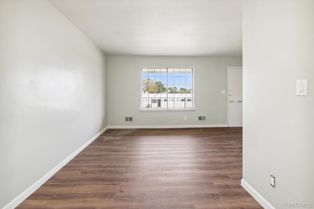 21121 Hayes Ave, Eastpointe, MI 48021 - empty room featuring dark wood-type flooring and baseboards