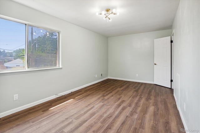 21121 Hayes Ave, Eastpointe, MI 48021 - empty room with wood finished floors and baseboards
