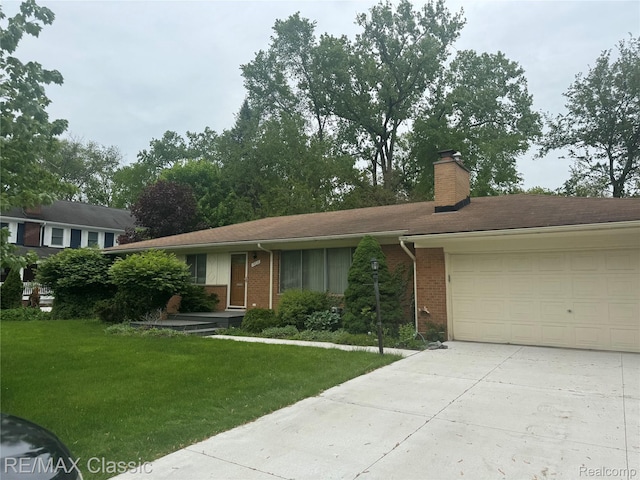 19332 Beverly Rd, Beverly Hills, MI 48025 - ranch-style home featuring concrete driveway, a garage, brick siding, and a front yard