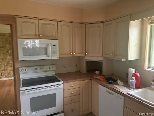 19332 Beverly Rd, Beverly Hills, MI 48025 - kitchen featuring white appliances, a sink, decorative backsplash, and light countertops