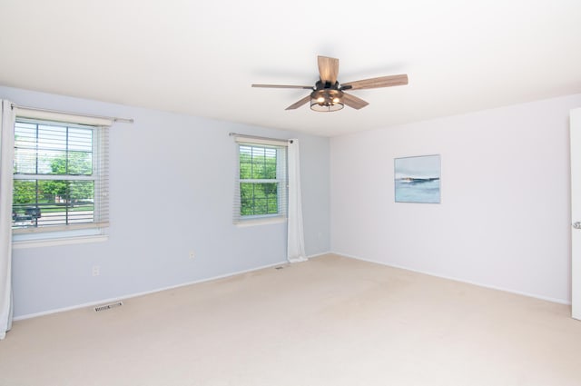 19578 Crystal Lake Dr, Northville, MI 48167 - spare room with light colored carpet, ceiling fan, and baseboards