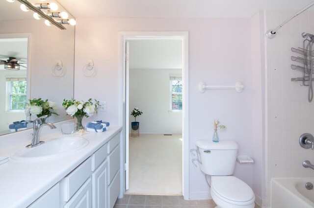 19578 Crystal Lake Dr, Northville, MI 48167 - full bathroom with vanity, toilet, bathtub / shower combination, and ceiling fan