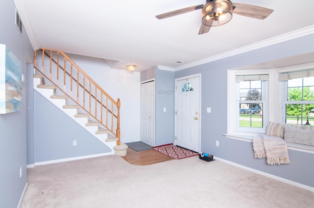 19578 Crystal Lake Dr, Northville, MI 48167 - carpeted foyer featuring crown molding, stairs, ceiling fan, and baseboards