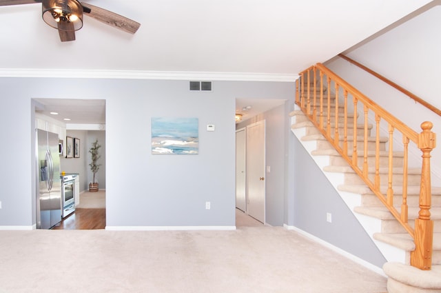 19578 Crystal Lake Dr, Northville, MI 48167 - unfurnished living room with a ceiling fan, stairs, carpet flooring, baseboards, and crown molding