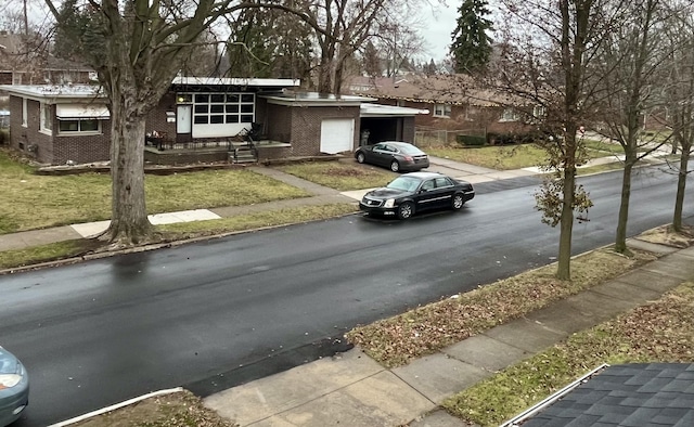 4344 10th St, Ecorse, MI 48229 - view of asphalt road with sidewalks and curbs