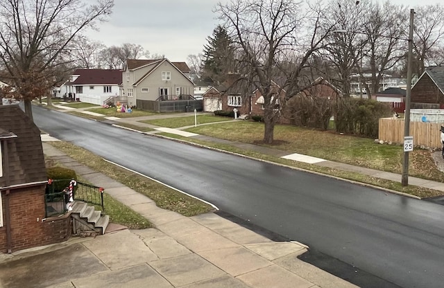 4344 10th St, Ecorse, MI 48229 - view of asphalt street with sidewalks, a residential view, and curbs
