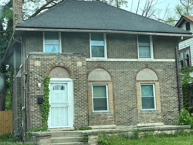 5050 Somerset Ave, Detroit, MI 48224 - view of front of home featuring brick siding, a chimney, and a shingled roof