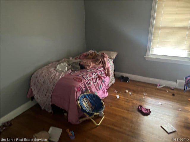 5050 Somerset Ave, Detroit, MI 48224 - bedroom featuring baseboards and wood finished floors