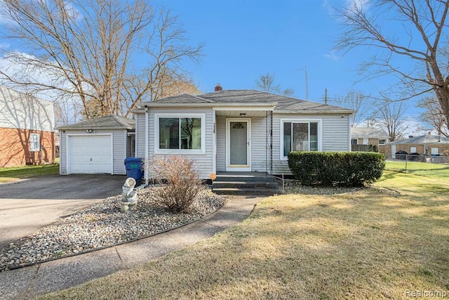 236 Helmar Ct, Benton Harbor, MI 49022 - bungalow-style house featuring an outbuilding, a chimney, driveway, and a garage