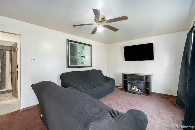 236 Helmar Ct, Benton Harbor, MI 49022 - living room with carpet, ceiling fan, and a lit fireplace