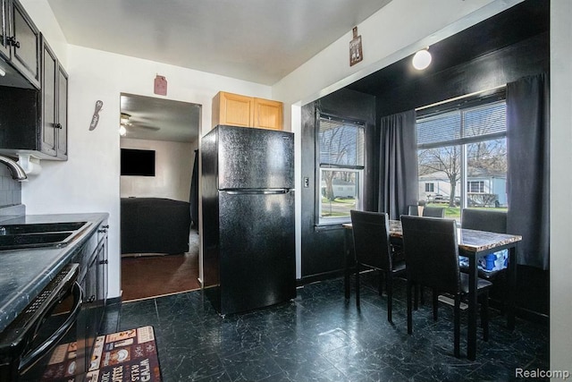 236 Helmar Ct, Benton Harbor, MI 49022 - kitchen with freestanding refrigerator, dishwasher, light brown cabinets, a ceiling fan, and a sink