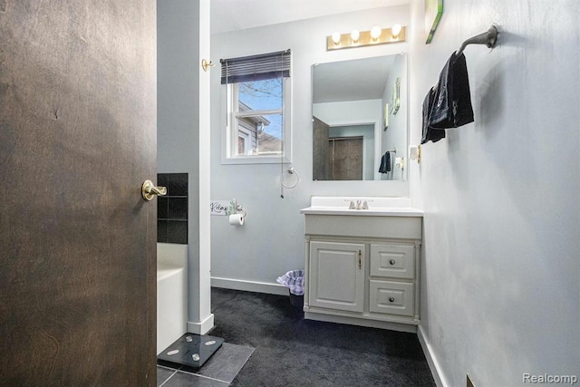 236 Helmar Ct, Benton Harbor, MI 49022 - bathroom with vanity, a tub to relax in, and baseboards
