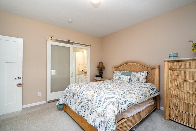 30877 County Road 687, Bangor, MI 49013 - carpeted bedroom with baseboards, a barn door, and connected bathroom
