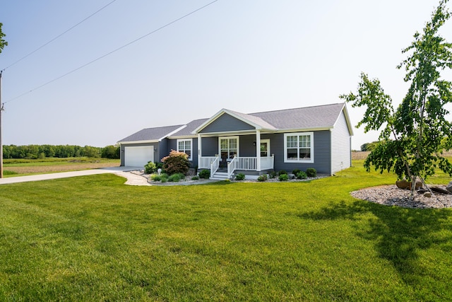 30877 County Road 687, Bangor, MI 49013 - single story home featuring a porch, concrete driveway, a garage, and a front yard