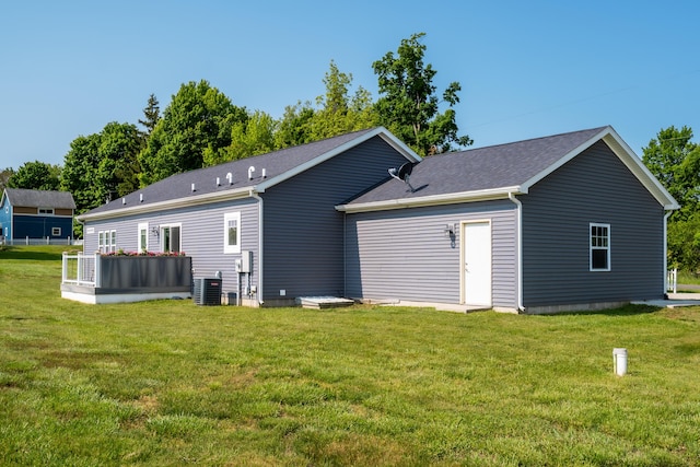 30877 County Road 687, Bangor, MI 49013 - back of house featuring cooling unit and a lawn