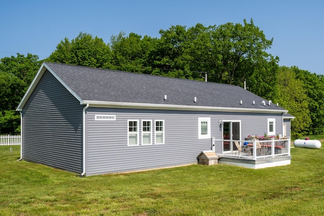 30877 County Road 687, Bangor, MI 49013 - rear view of property featuring a lawn, a wooden deck, and roof with shingles