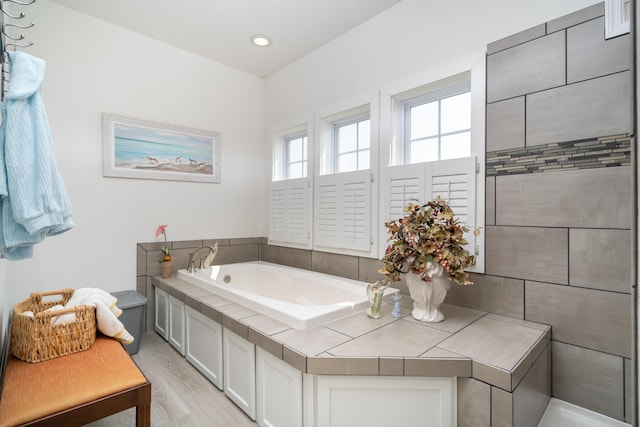 30877 County Road 687, Bangor, MI 49013 - bathroom with a bath, recessed lighting, and wood finished floors