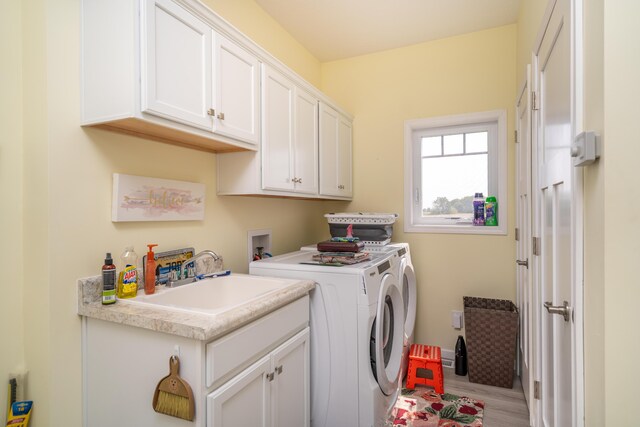 30877 County Road 687, Bangor, MI 49013 - washroom with cabinet space, washing machine and clothes dryer, and wood finished floors