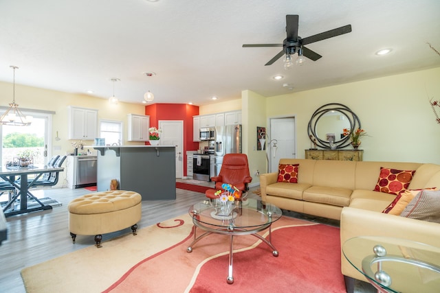 30877 County Road 687, Bangor, MI 49013 - living room featuring light wood-type flooring, a ceiling fan, and recessed lighting