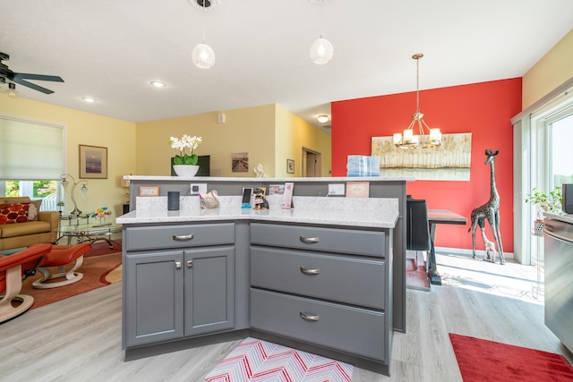 30877 County Road 687, Bangor, MI 49013 - kitchen featuring gray cabinets, a chandelier, light wood-type flooring, decorative light fixtures, and ceiling fan