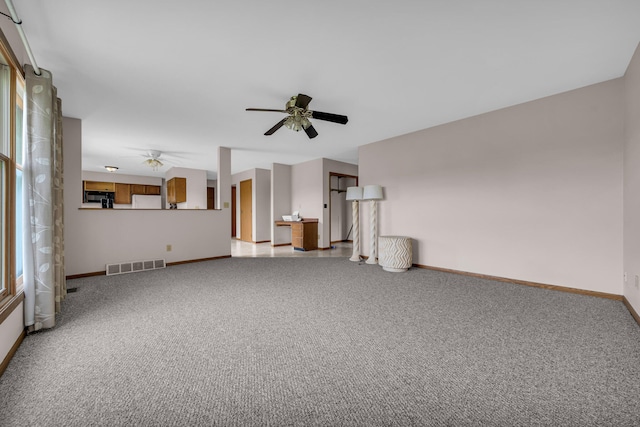 2045 E Baldwin Rd, Grand Blanc, MI 48439 - unfurnished living room featuring ceiling fan and carpet