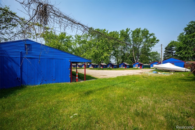 8230 Highland Rd, White Lake, MI 48386 - view of grassy yard with driveway