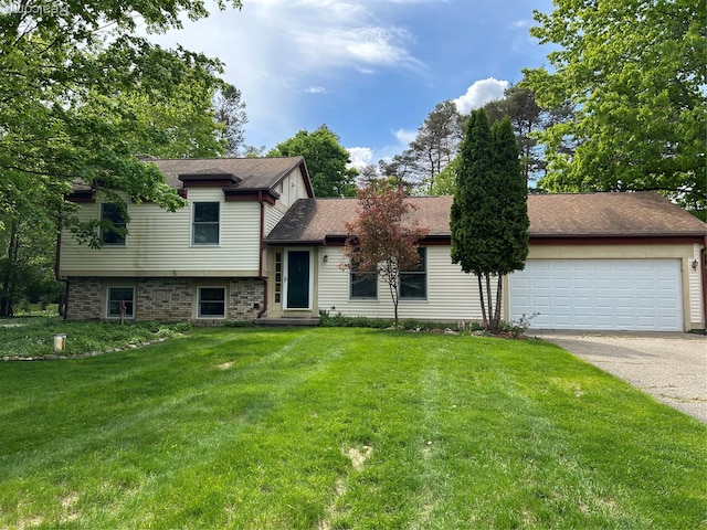 1690 Cedar Knoll Ln, Caro, MI 48723 - split level home featuring driveway, a front lawn, and a garage