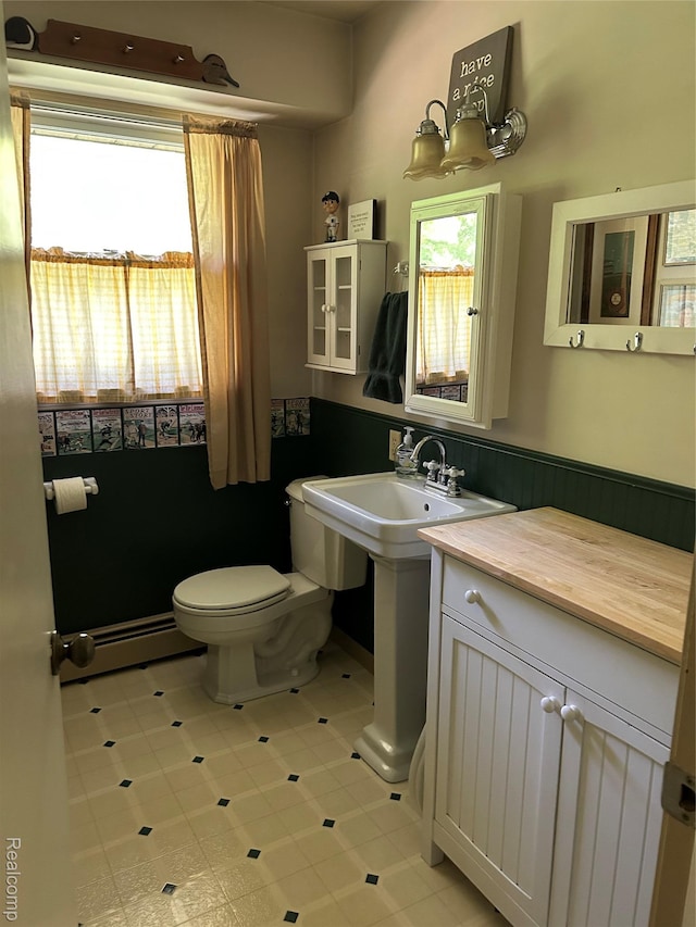 1690 Cedar Knoll Ln, Caro, MI 48723 - bathroom featuring baseboard heating and toilet