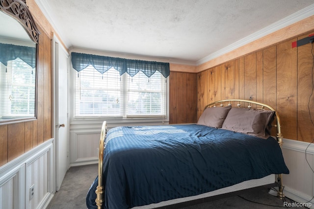 511 N Byfield St, Westland, MI 48185 - bedroom with multiple windows, a textured ceiling, carpet floors, crown molding, and wooden walls