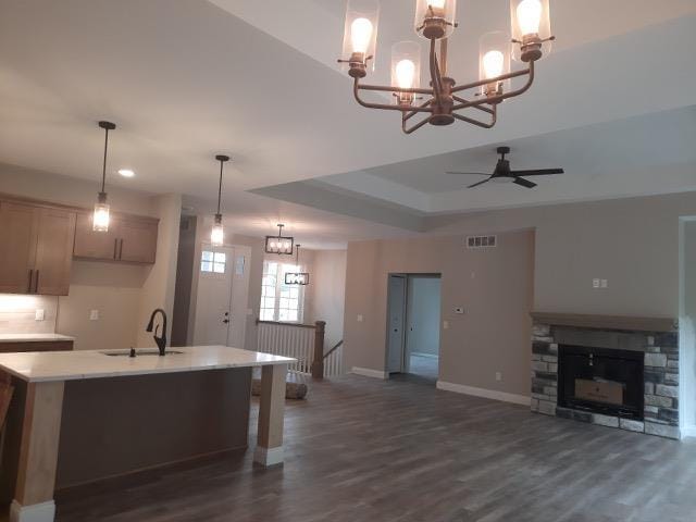 16445 Sleepy Hollow Dr, Fenton, MI 48430 - kitchen with a chandelier, dark wood-style flooring, light countertops, open floor plan, and recessed lighting