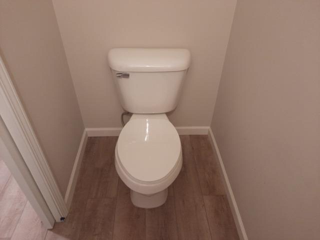 16445 Sleepy Hollow Dr, Fenton, MI 48430 - bathroom featuring wood finished floors and toilet