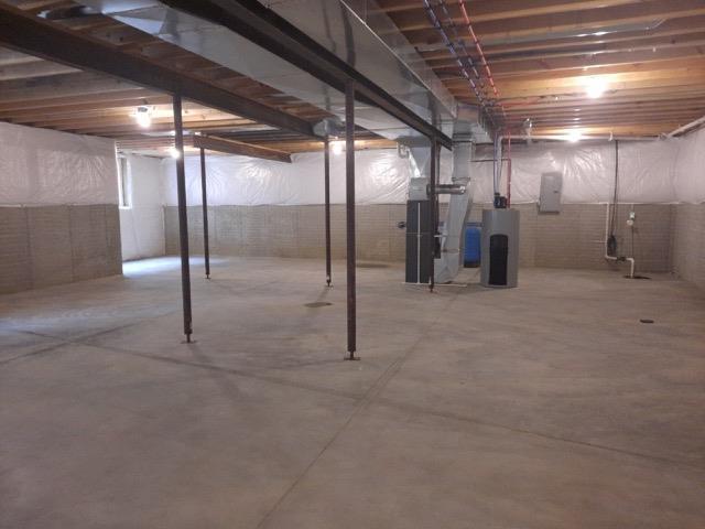 16445 Sleepy Hollow Dr, Fenton, MI 48430 - unfinished below grade area with heating unit, electric panel, and water heater