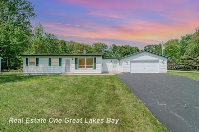 4675 E Parish Rd, Midland, MI 48642 - single story home featuring a garage, a front yard, and driveway