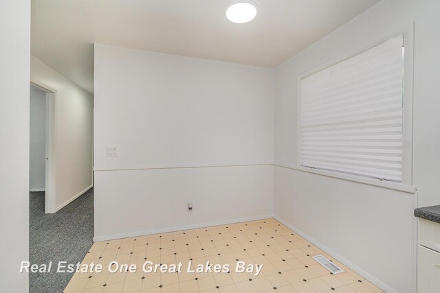 4675 E Parish Rd, Midland, MI 48642 - empty room with baseboards and light flooring