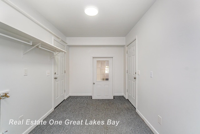 4675 E Parish Rd, Midland, MI 48642 - washroom featuring dark carpet and baseboards