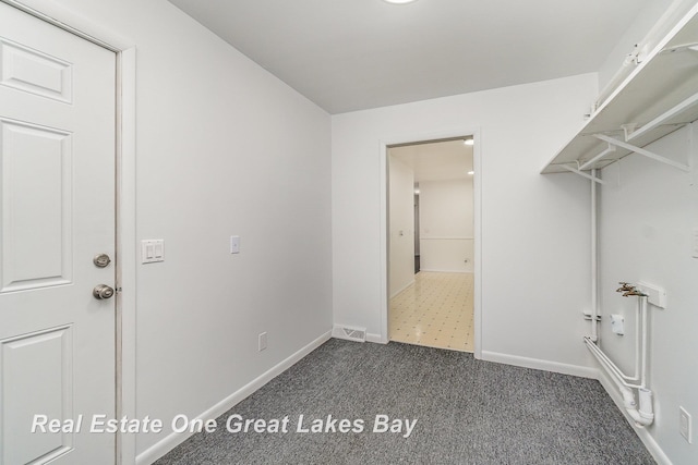 4675 E Parish Rd, Midland, MI 48642 - laundry room featuring carpet floors and baseboards