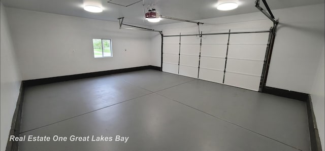 4675 E Parish Rd, Midland, MI 48642 - garage featuring a garage door opener