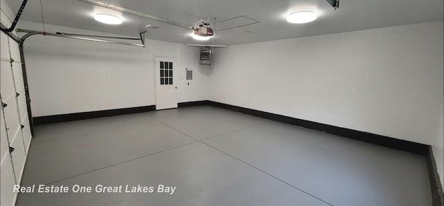 4675 E Parish Rd, Midland, MI 48642 - garage with a garage door opener and baseboards
