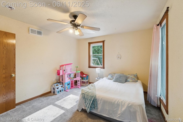 3244 Huggins Ave, Flint, MI 48506 - bedroom with carpet flooring, a ceiling fan, a textured ceiling, and baseboards