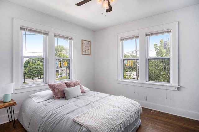 75 Diamond Ave NE, Grand Rapids, MI 49503 - bedroom featuring dark wood-style flooring, baseboards, and ceiling fan