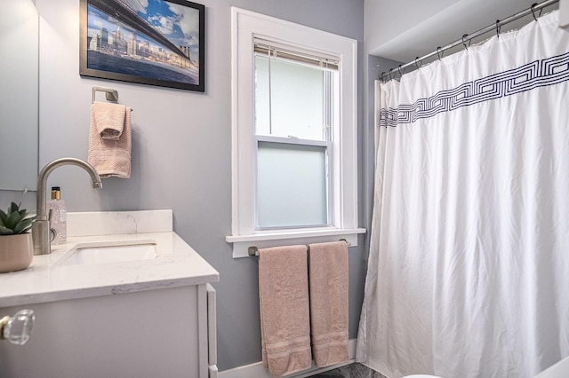 75 Diamond Ave NE, Grand Rapids, MI 49503 - bathroom with vanity, baseboards, and curtained shower
